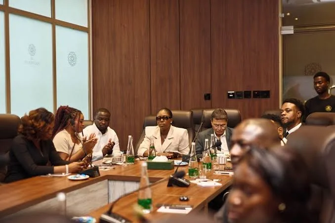 Participants around a boardroom table during a roundtable session